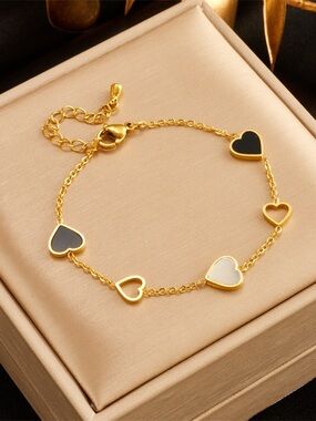 Gold Heart Link Bracelet with Black and White Hearts